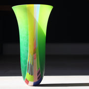 Tall vase in vibrant  tone of green ,yellow, pink and blue by glass artist Ruth Shelley