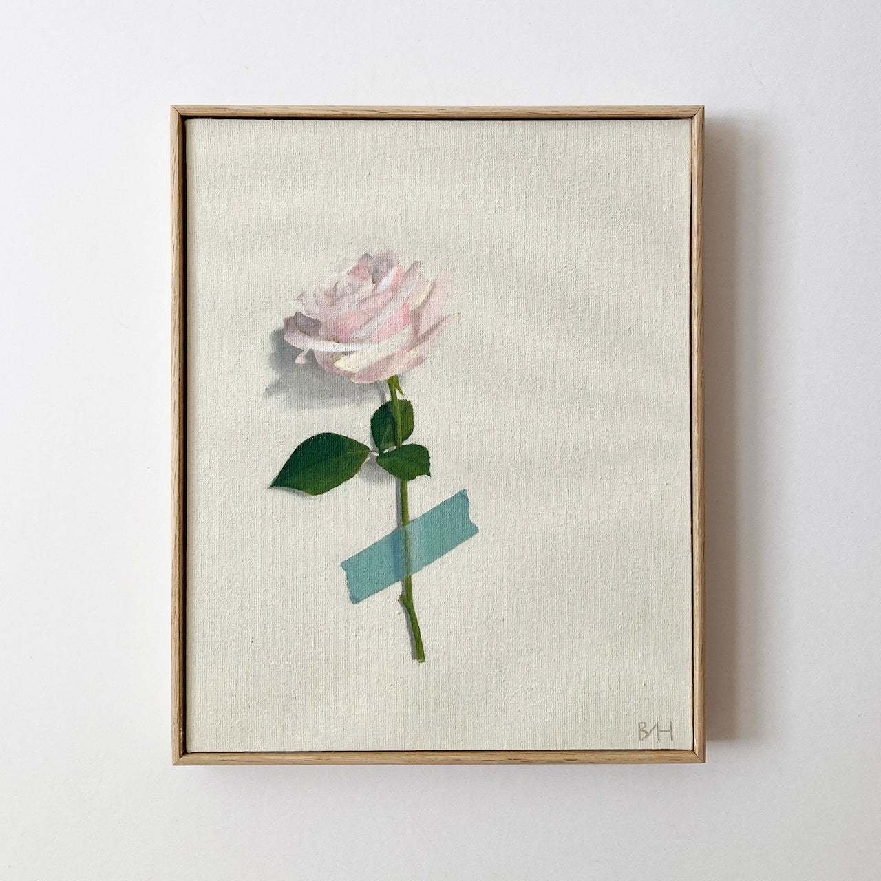 Neutral background with painting of single stemmed white rose covered by blue a piece of blue tape by artist Bess Harding