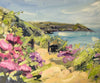 Sandy pathway leading through pink and violet flowers towards headland, a seascape painting by Jill Hudson