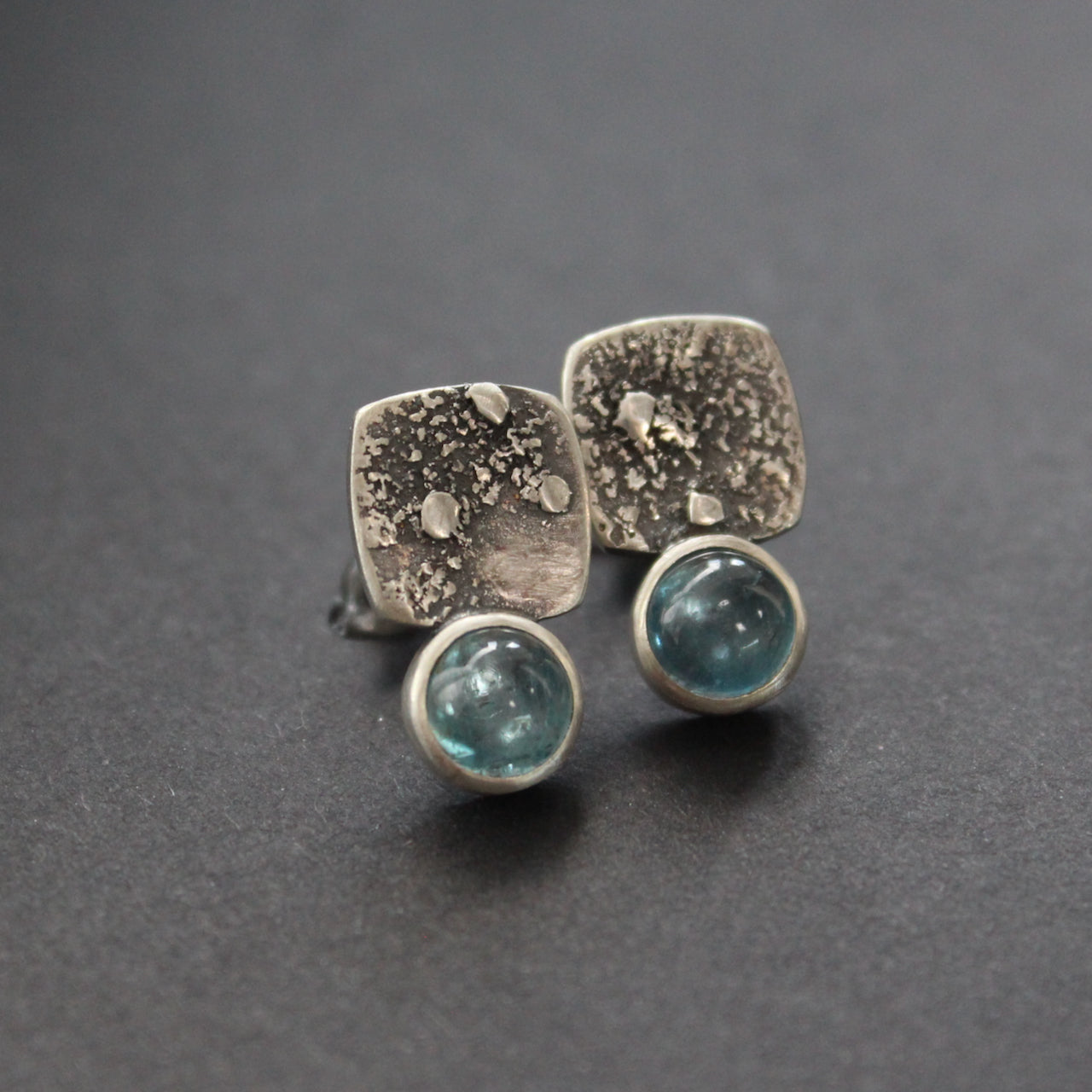 square textured silver earrings with pale blue stone by UK jewellery designer Carin Lindberg 