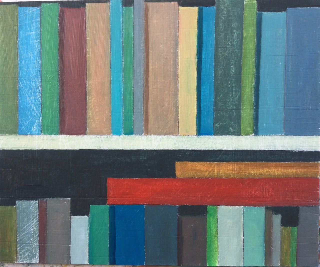 Two bookshelves containing varying coloured books by artist Philip Lyons