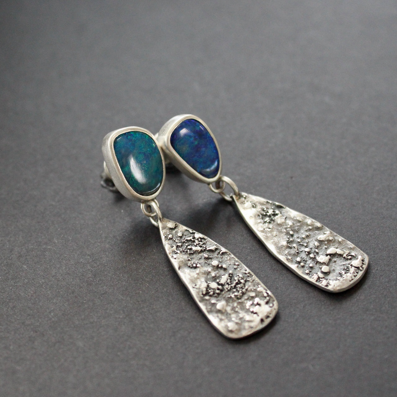 blue opal stones set in silver in long earrings by Carin Lindberg