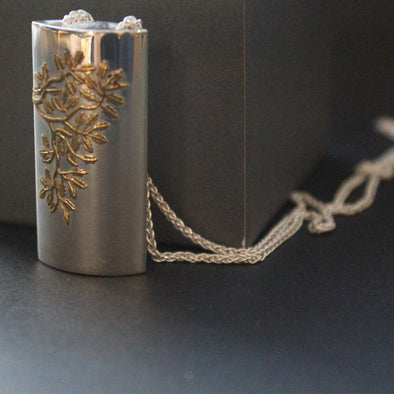 Silver box pendant with flower design by artist Beverly Bartlett