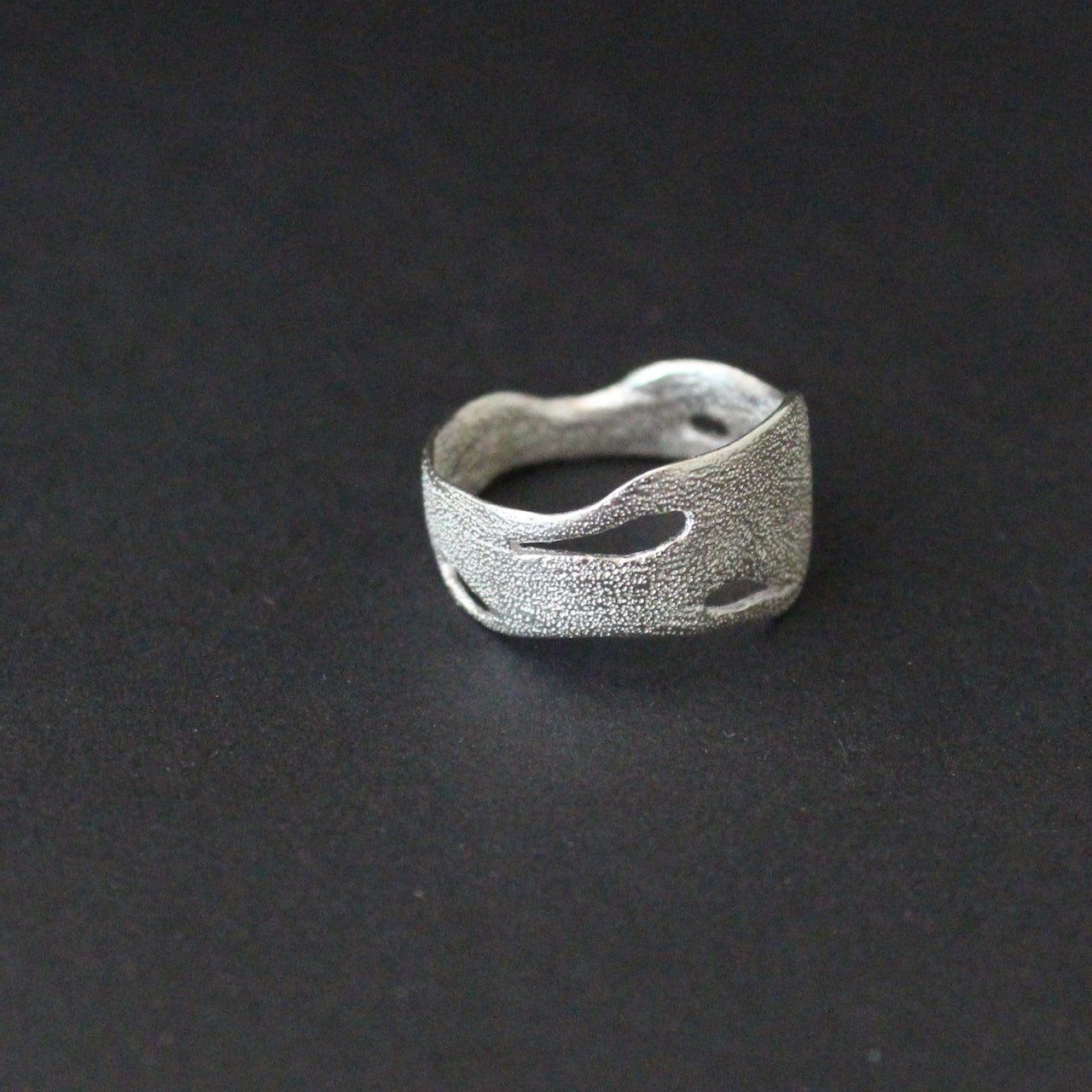 Organically hand sculpted silver Sea Siren ring, with delicate handcrafted surface detail by artist Claire Stockings-Baker