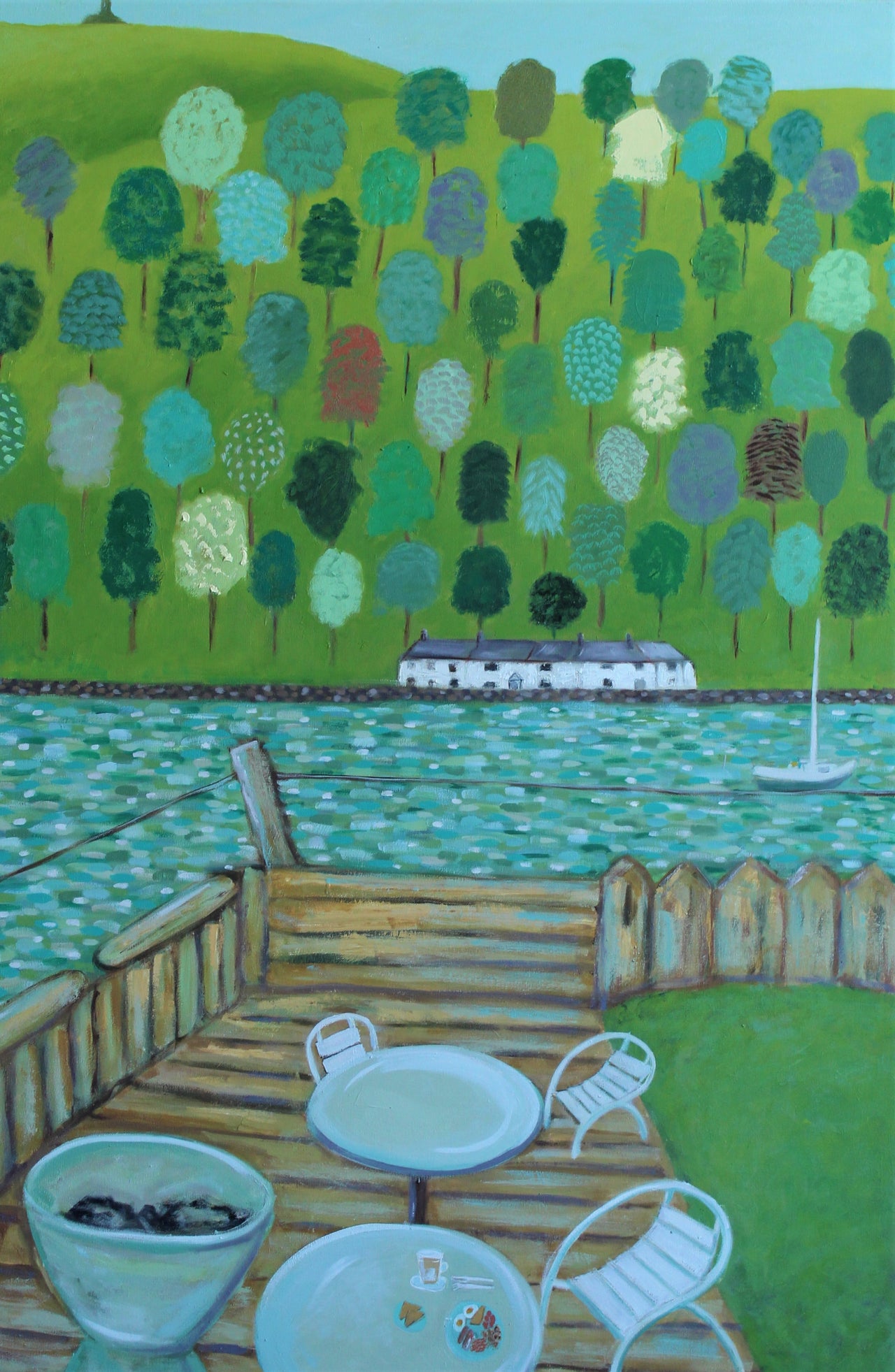 White chairs and tables set on the marina looking out to sea, with multicoloured  trees and white houses on the peninsula by Cornish artist Siobhan Purdy