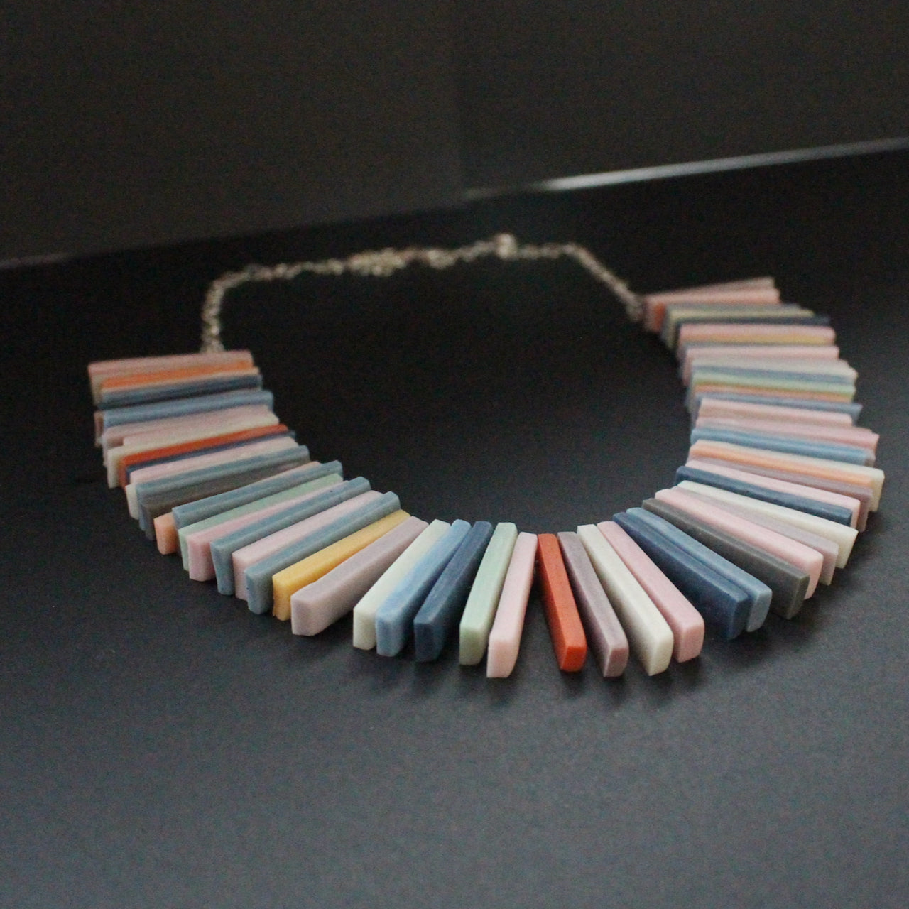 Polymer & resin clay rectangles in muted earth tones necklace by artist Clare Lloyd
