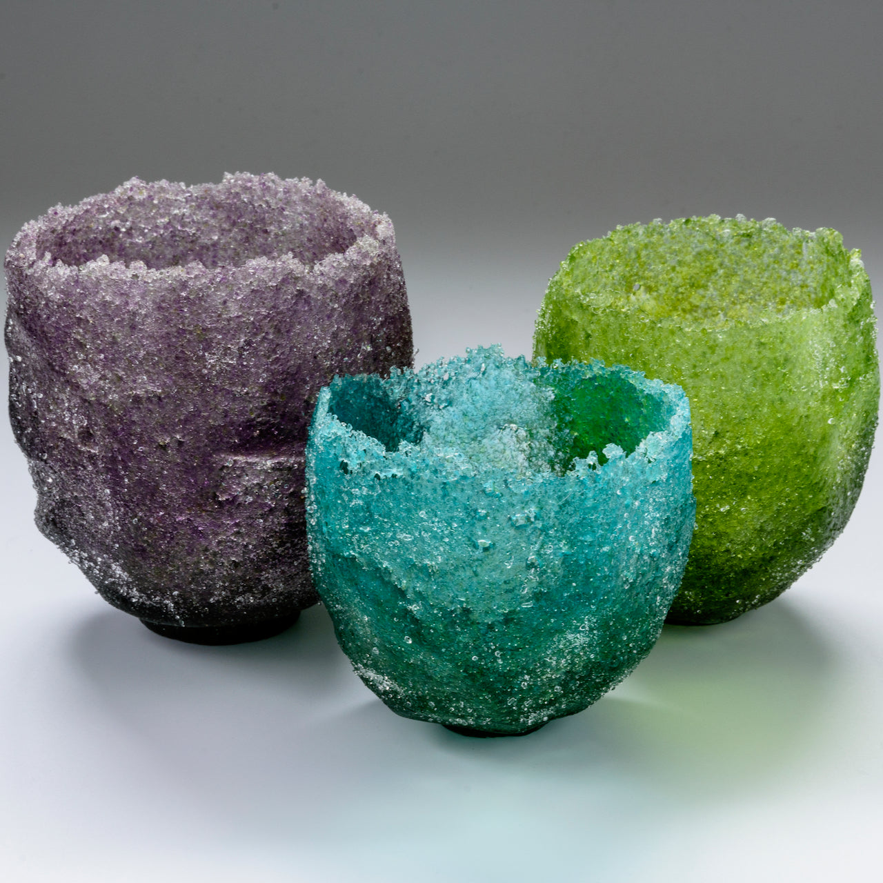 Purple heavily textured glass vessel by artist Caroline Reed