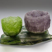 Glass vessel in heavily textured purple by artist Caroline Reed