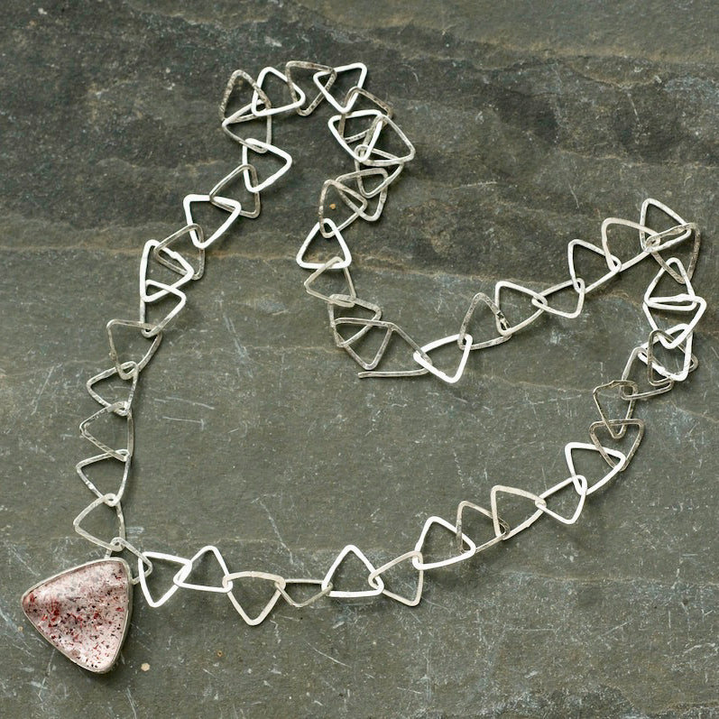 Silver triangle link necklace with triangle Fire Quartz stone pendant by Cornish artist Lucy Spink
