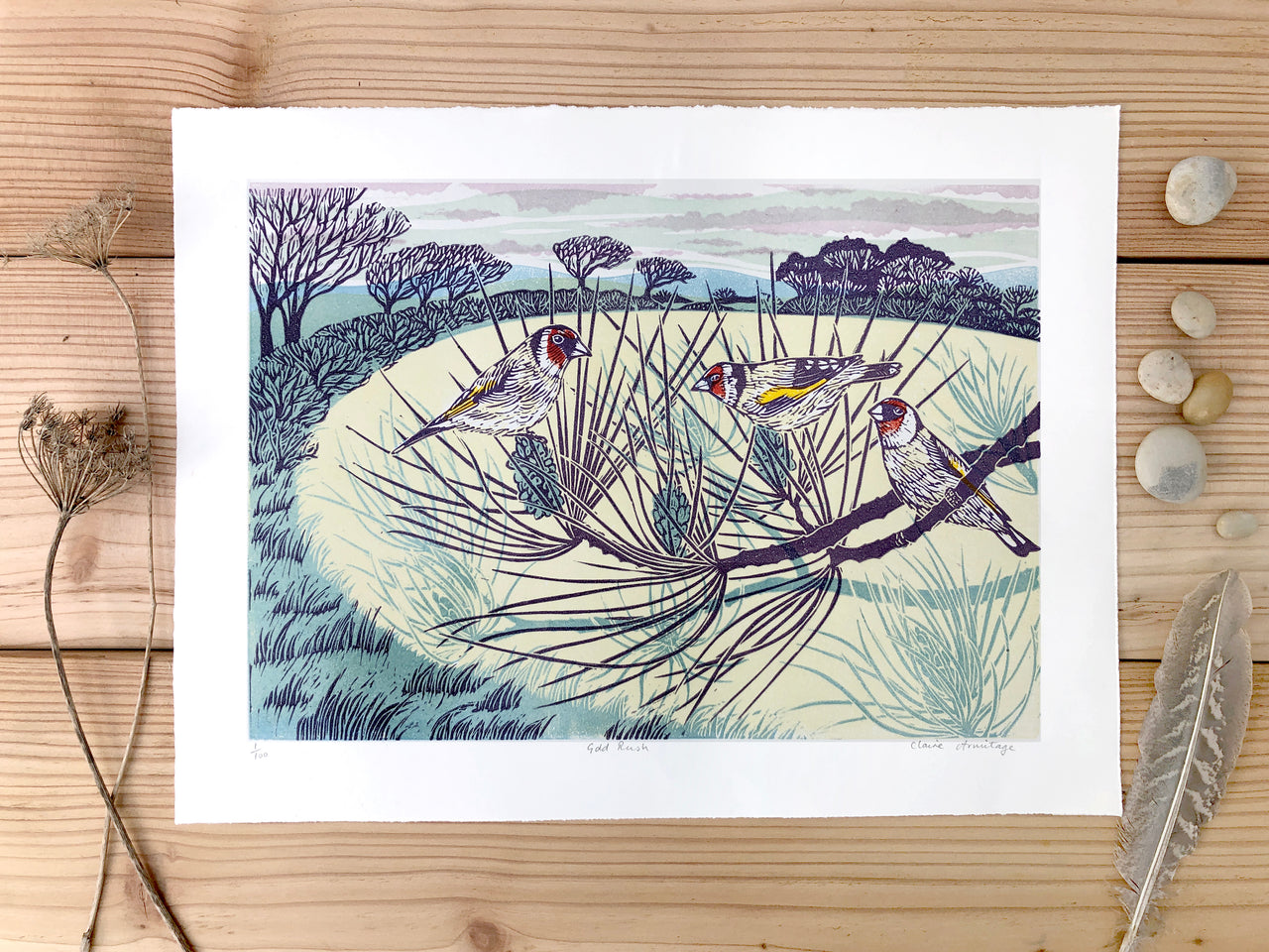 Three birds on branches, with trees and hedgerow in the background by artist Claire Armitage