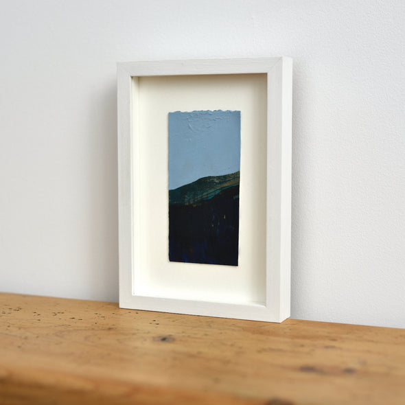 Dark hillside landscape with blue sky mixed media painting by Alice Robinson-Carter.