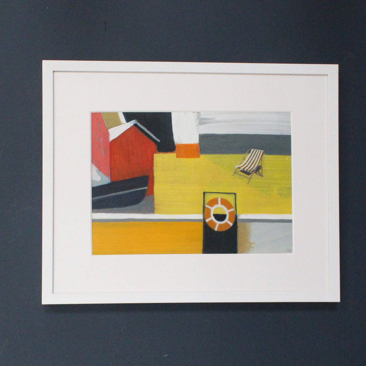 a framed painting by Heath Hearn of a stripy deckchair on a yellow painted boat with an orange rubber ring in the foreground