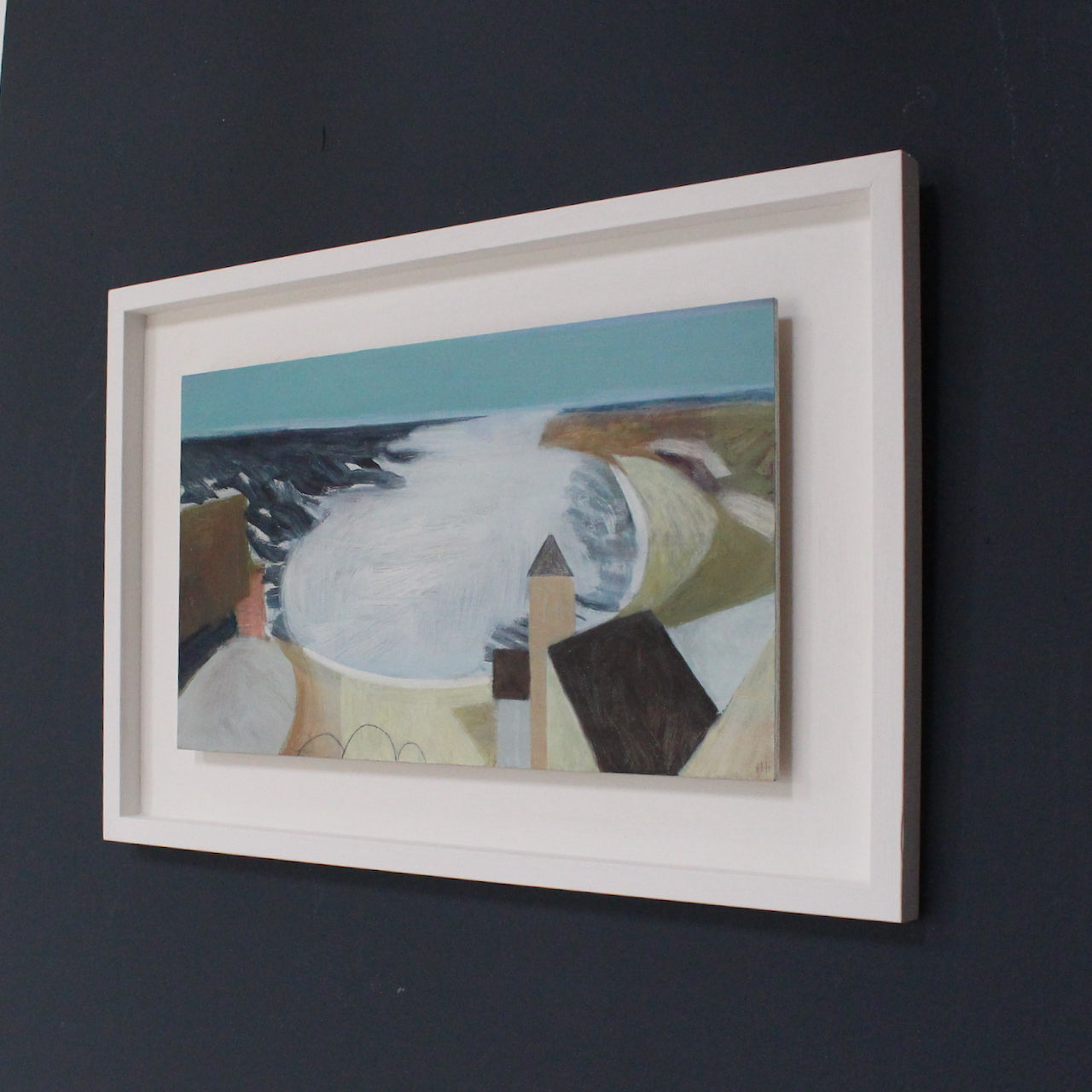 framed Heath Hearn painting of a Cornish bay with blue sky and dark blue sea and a tower facing into the cove.
