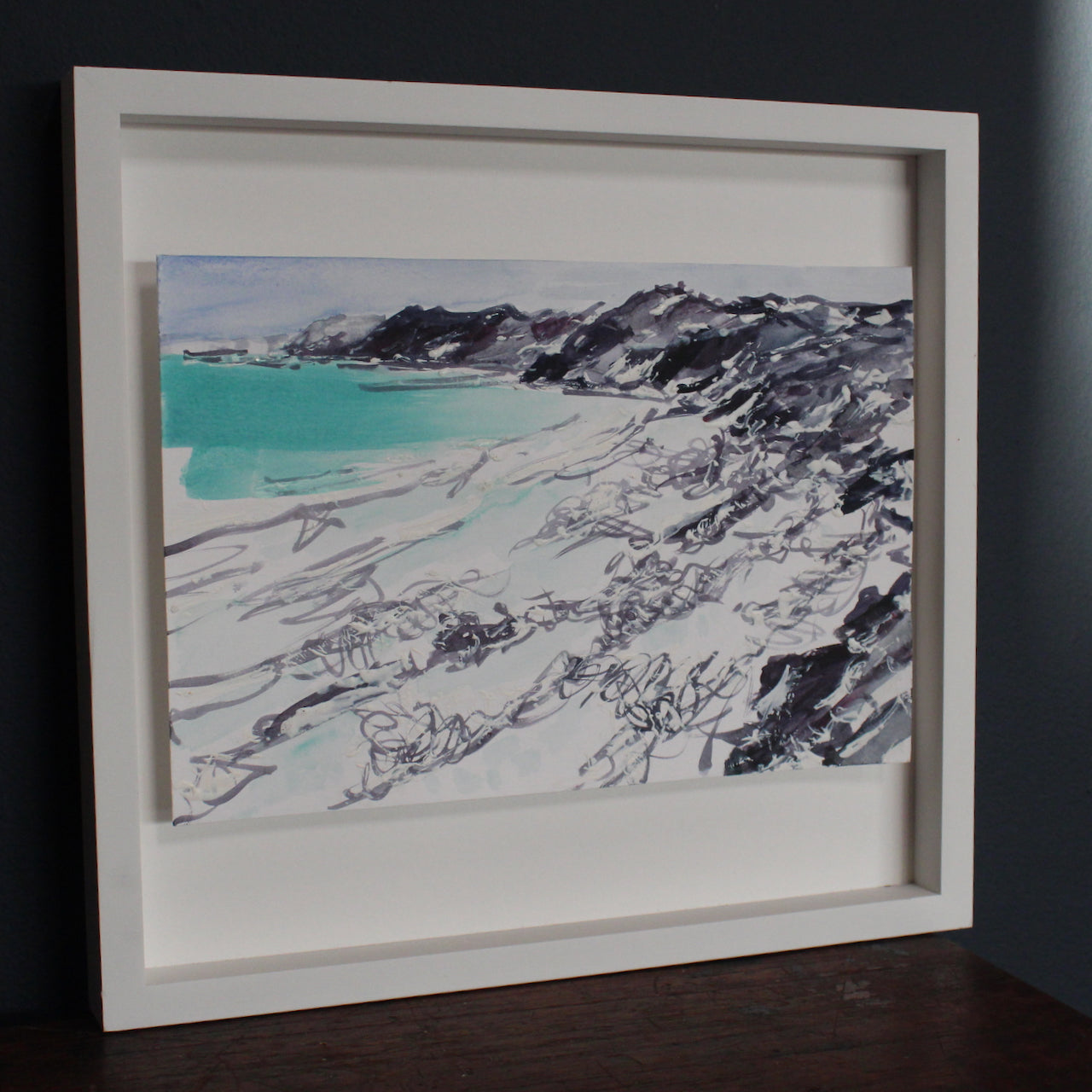 Watercolour painting by Jill Hudson of Tregantle beach in Cornwall with dark cliffs and turquoise sea