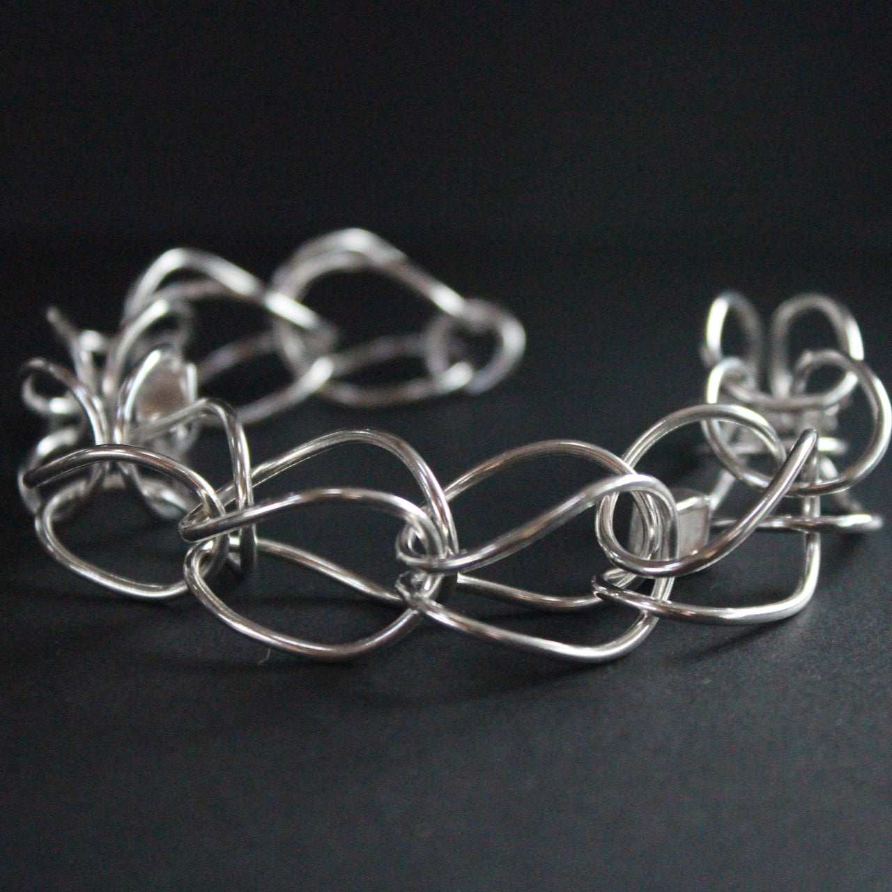 Sterling silver loop in loop chain bracelet by artist Amy Stringer