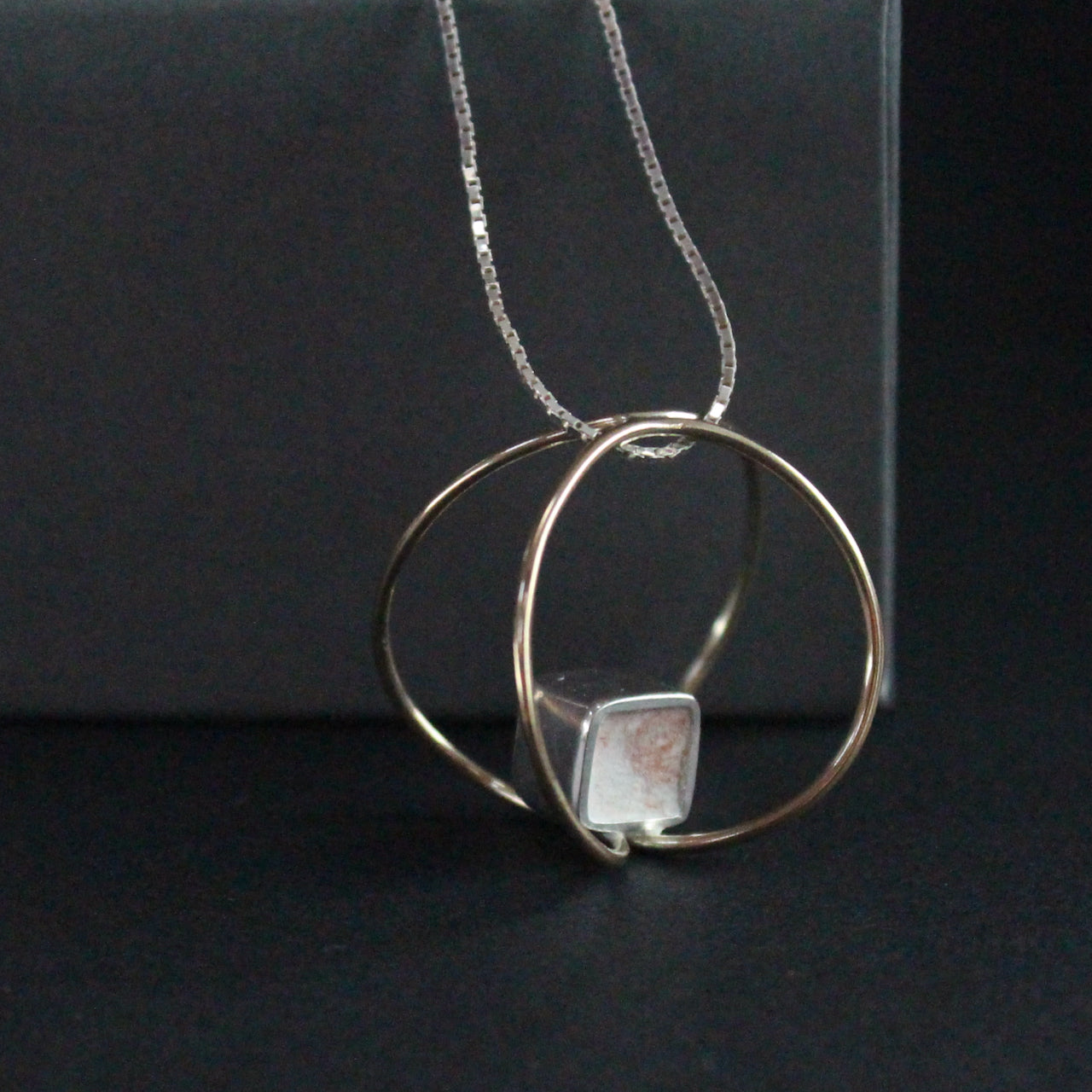 9ct gold and silver link pendant by artist Amy Stringer.