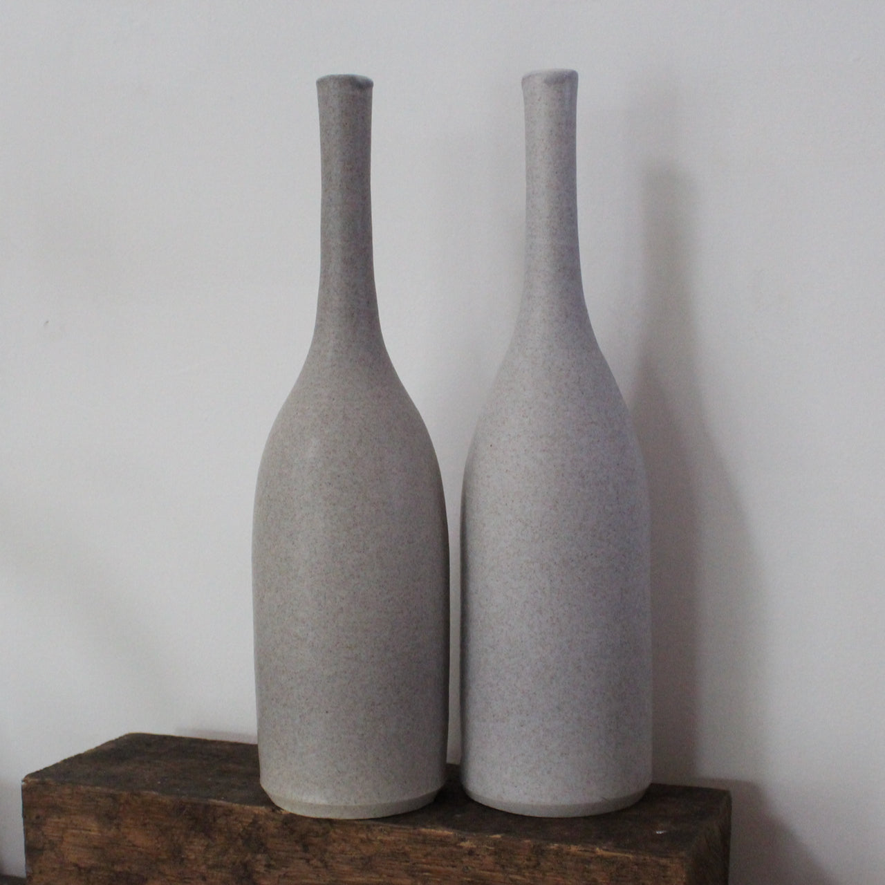 a pair of grey ceramic bottles by UK ceramicist Lucy Burley.