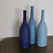 trio of blue ceramic bottles by ceramic artist Lucy Burley.