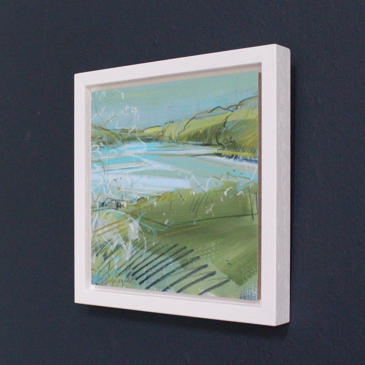 A small landscape painting by Imogen Bone, Cornish artist, it is of  green and ochre hills, pale blue river with hints of white and turquoise