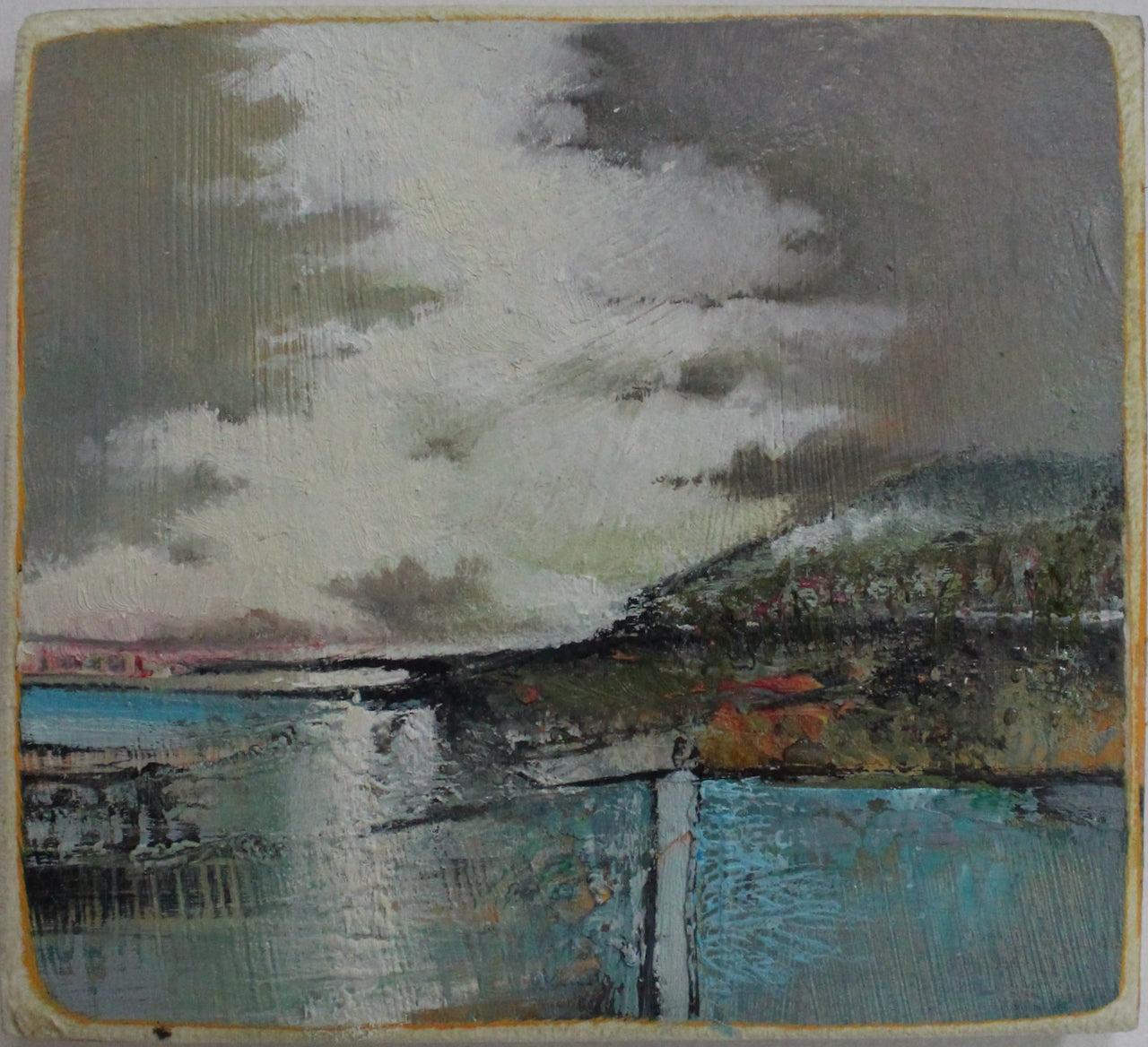 Julie Ellis small painting of a headland against a grey and lilac sky and a pale blue sea