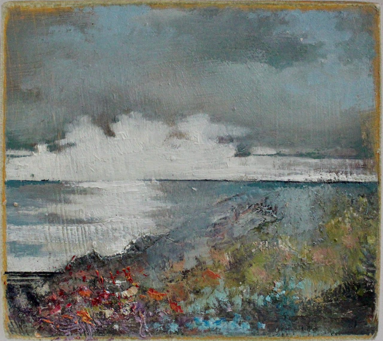 Julie Ellis seascape painting of white clouds on the horizon of a blue sea with flowers in the foreground 