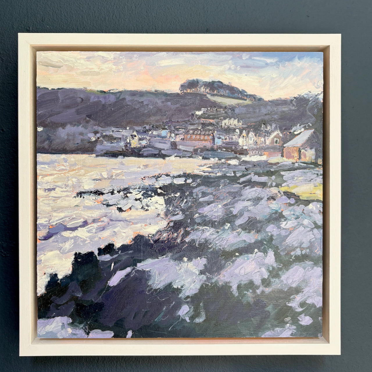 Framed painting of a coastal scene Cawsand in Cornwall with houses and hills by Jill Hudson