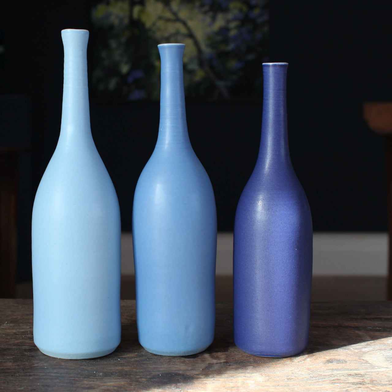 trio of ceramic bottles in shades of blue by UK ceramic artist Lucy Burley