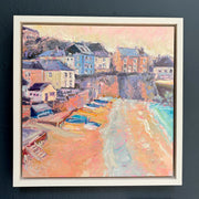 Jill Hudson framed painting of a coastal scene with houses and boats on Cawsand beach Cornwall.