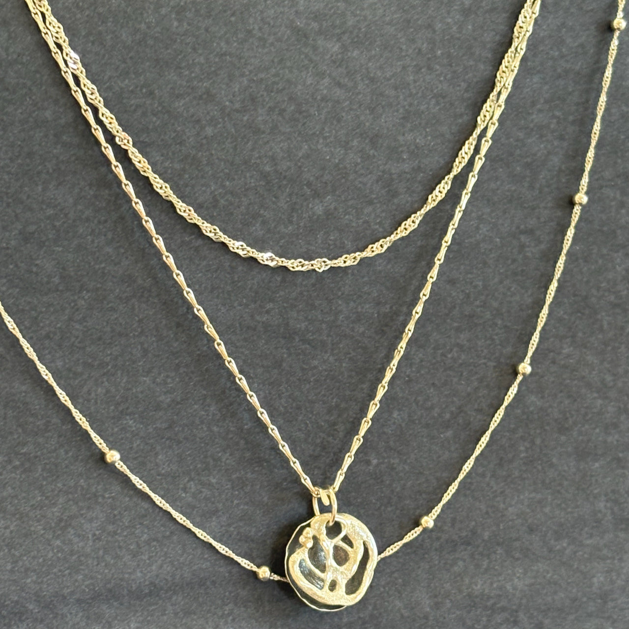 Claire Stockings-Baker - Silver pendant with three chains