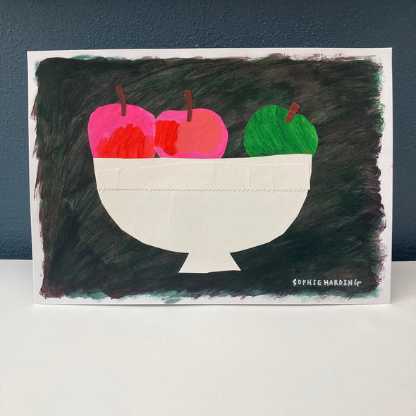 Pink and green apples in a white bowl on a  black background by Cornish artist Sophie Harding