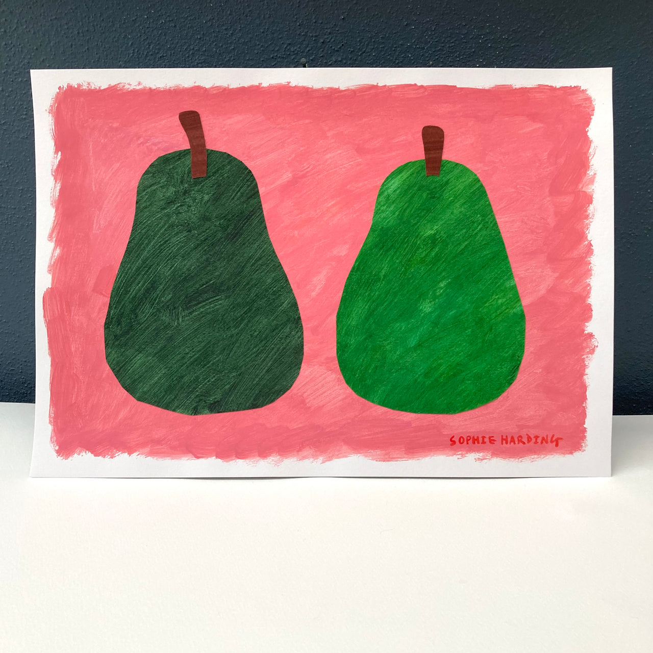 Sophie Harding painting of two green pairs on a pink background 