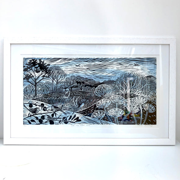 Black and blue tone lino prints by artist Claire Armitage of landscape, trees, birds and sky