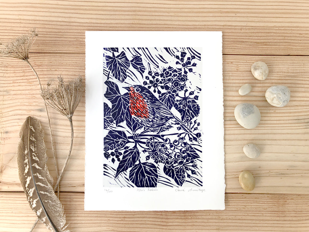 Blue & red robin lino print by artist Claire Armitage