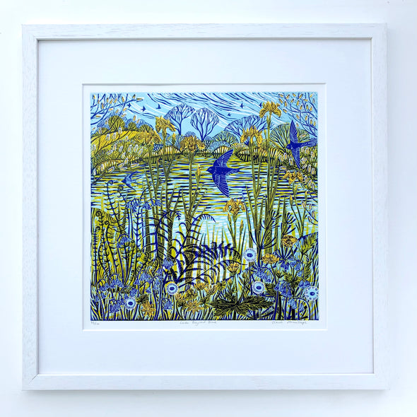 Lino print by artist Claire Armitage with blue and yellow tones of lake, foliage, trees and birds