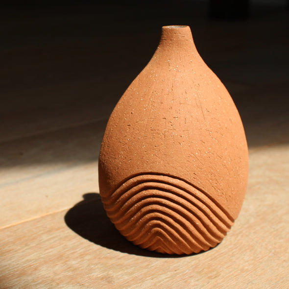 hand carved, tinted stoneware medium sized mid terracotta bottle with line detail by artist Michele Bianco