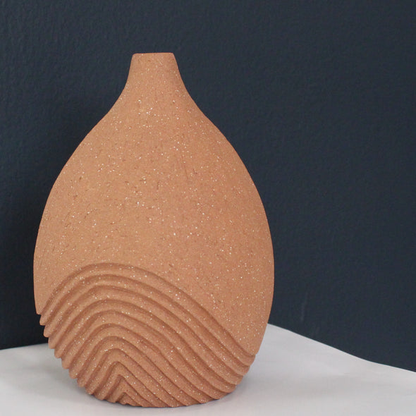 hand carved, tinted stoneware medium sized mid terracotta bottle with line detail by artist Michele Bianco.
