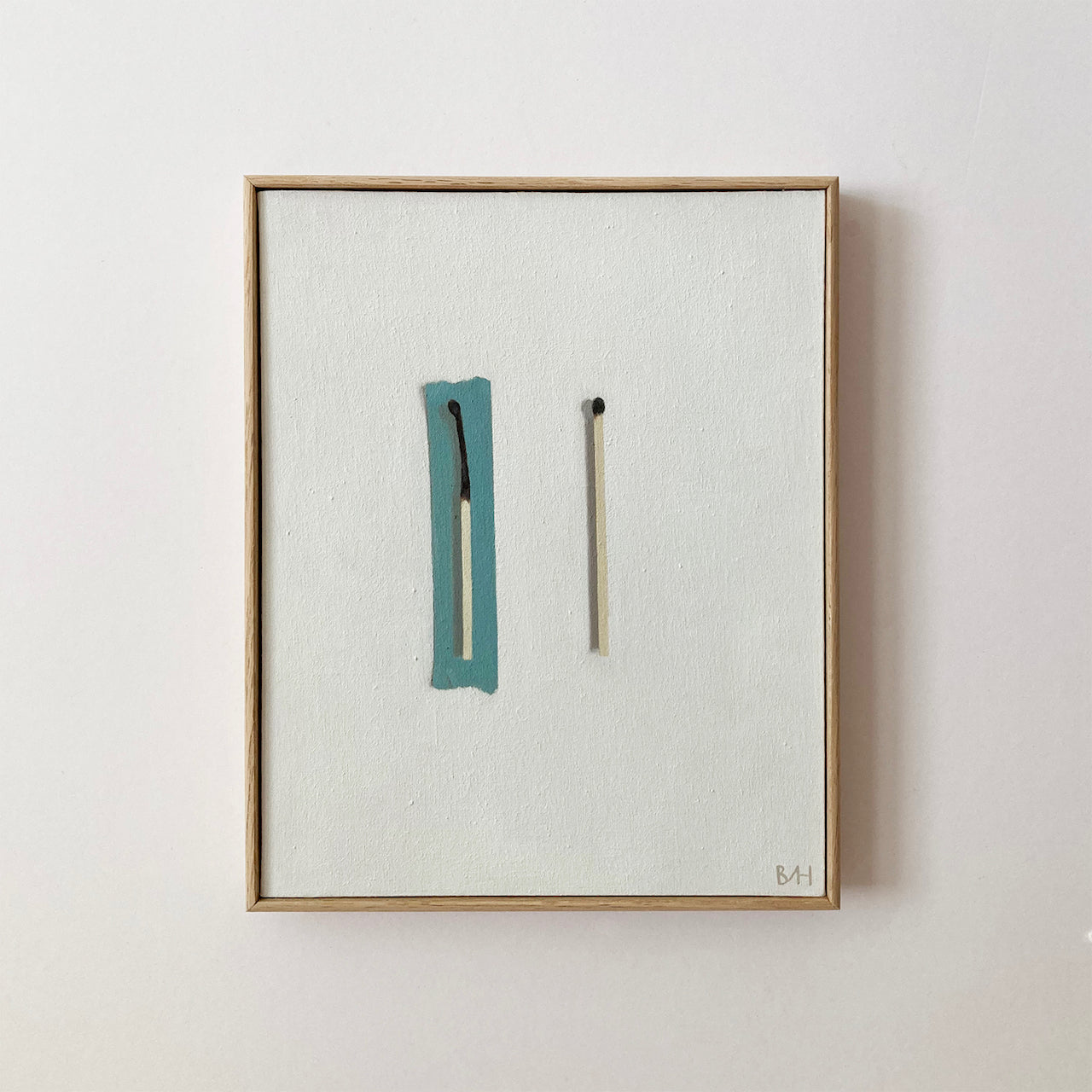 Neutral background with painting of half burnt match and unburnt match by artist Bess HardingNeutral background with painting of half burnt match with turquoise tape behind next to unburnt match by artist Bess Harding