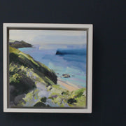 small square Jill Hudson painting of Rame Head in Cornwall in pastel tones with dark green cliffs.