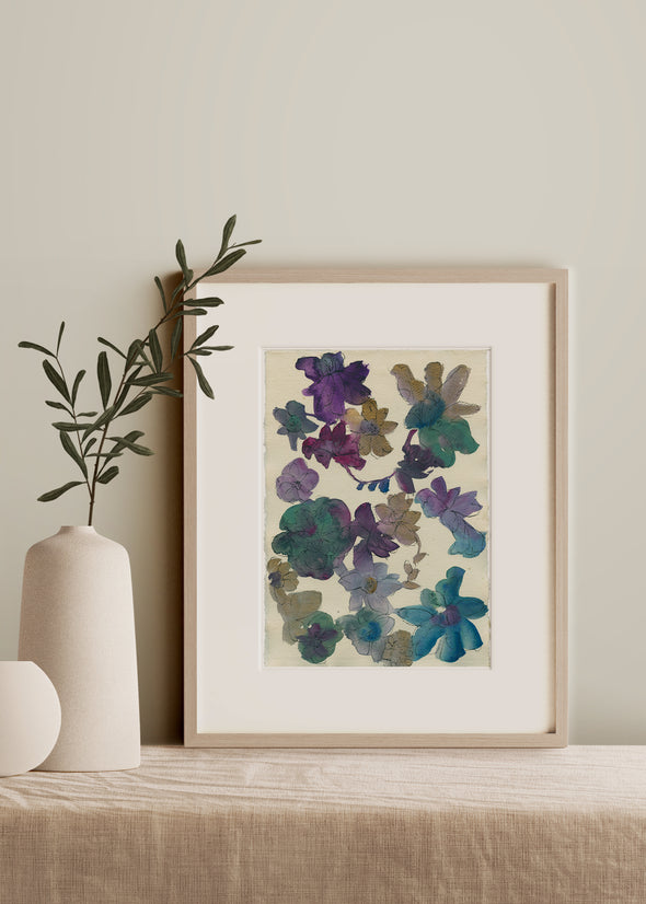 Ink flower painting in tones of blue and ochre by artist Lucy Innes Williams