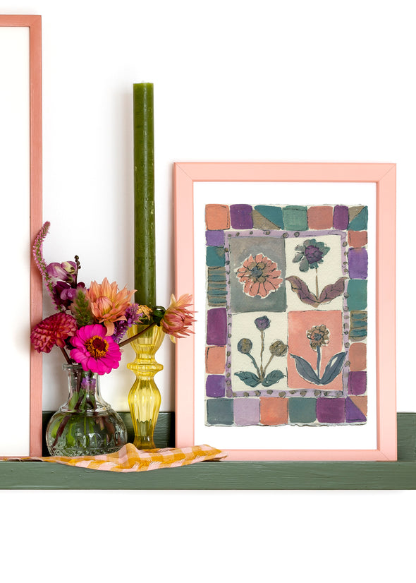 Artist Lucy Williams ink painting of four flowers enclosed by geometric square in pink and green tones.