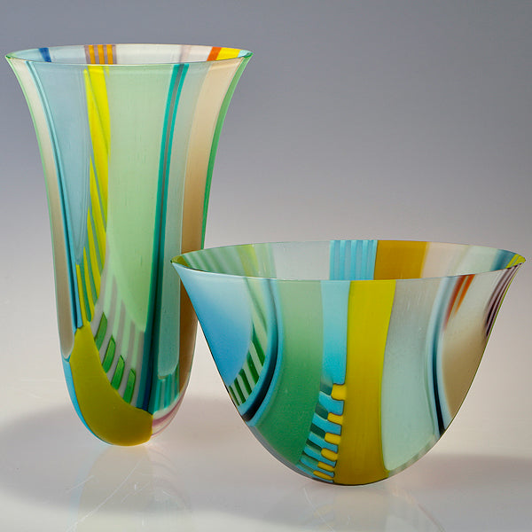 a pair of glass vessels in blues and greens by Ruth Shelley, glass artist