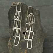 Silver mini monolith shape chain earrings by UK artist Lucy Spink.