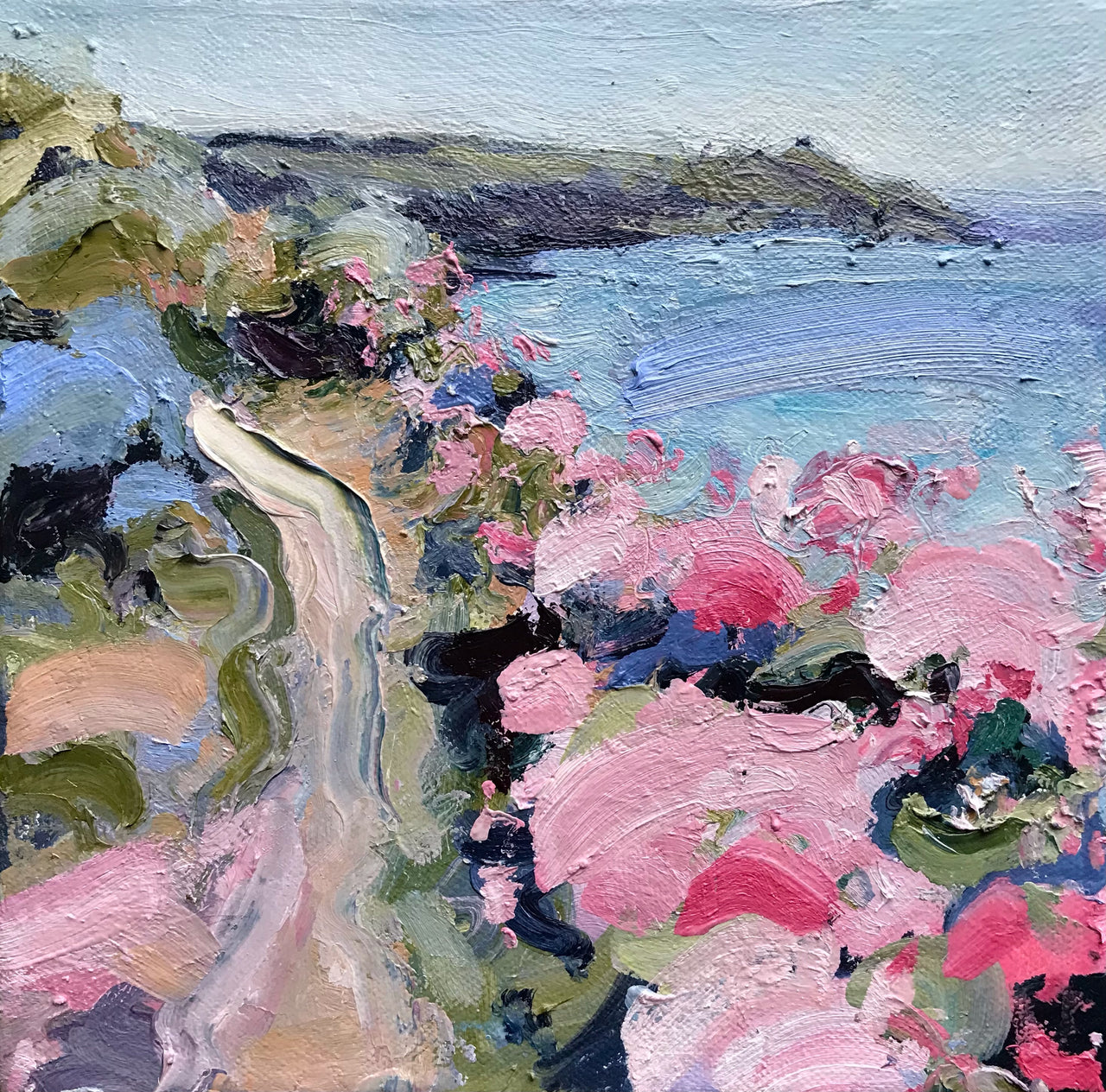 Jill Hudson oli painting of Rame Head in south east cornwall, the headland is dark green with a pale blue and purple sea and the coast path  features pink, white and blue wildflowers