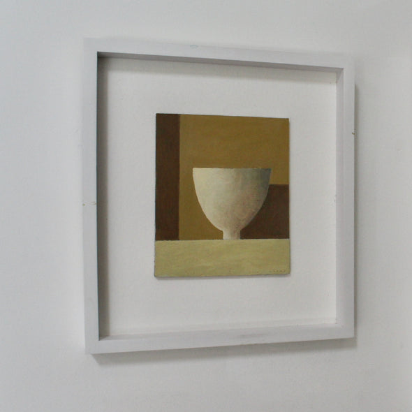 Framed painting of white bowl and shadow on shelf in front of gold wall by UK artist Philip Lyons.