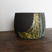 Hand built ceramic vessel with blue, yellow and white glaze on dark brown clay by Cornish artist Anthea Bowen.