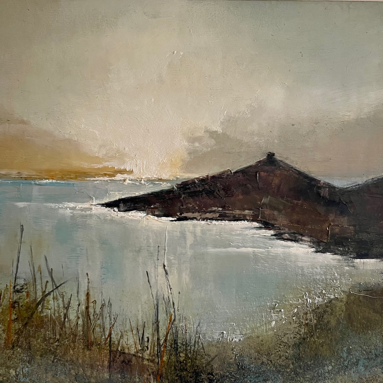 Sun setting beside Rame Head and headland foliage in foreground by artist Julie Ellis
