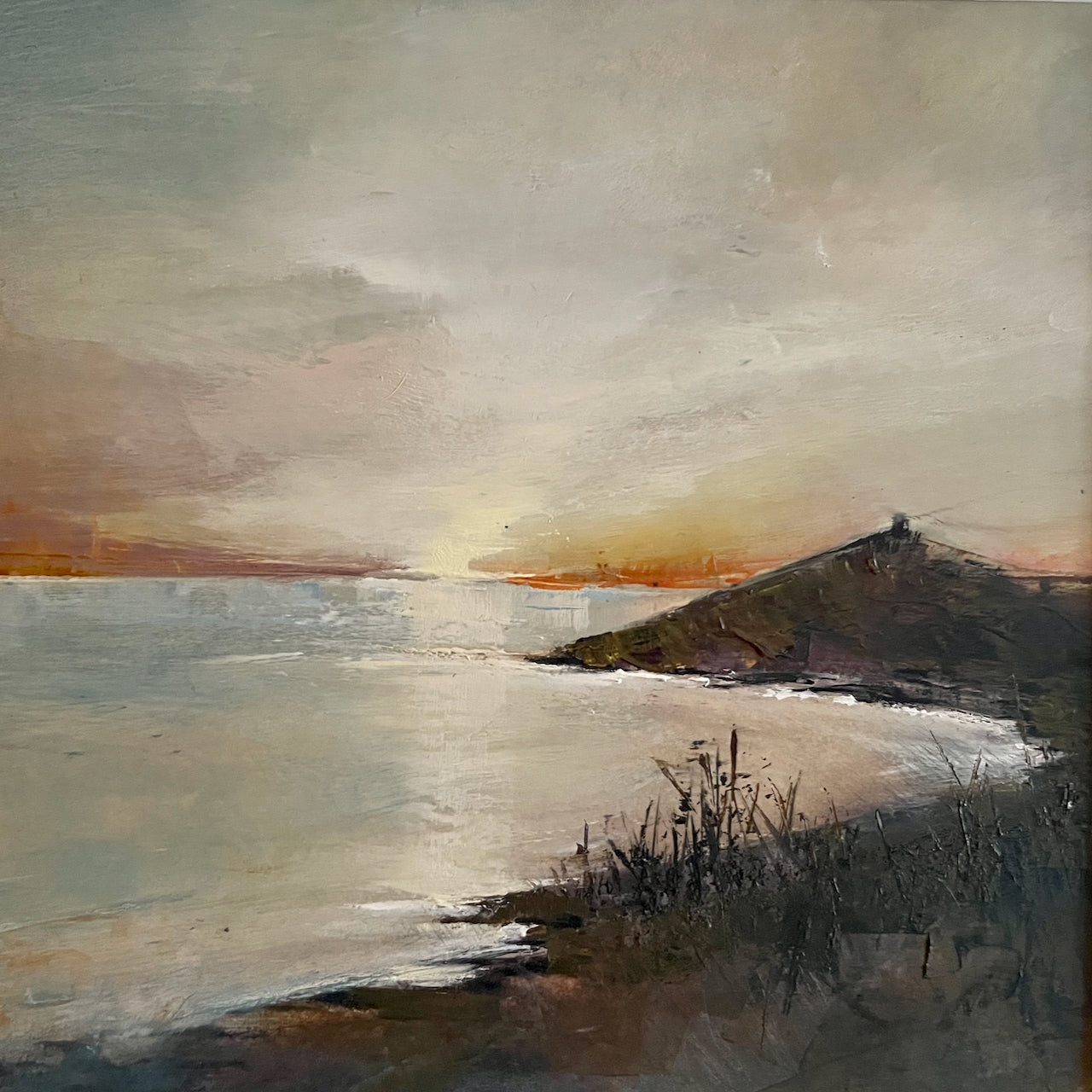 Beautiful seascape with tones of orange sky as sun goes down next to Rame Head by artist Julie Ellis