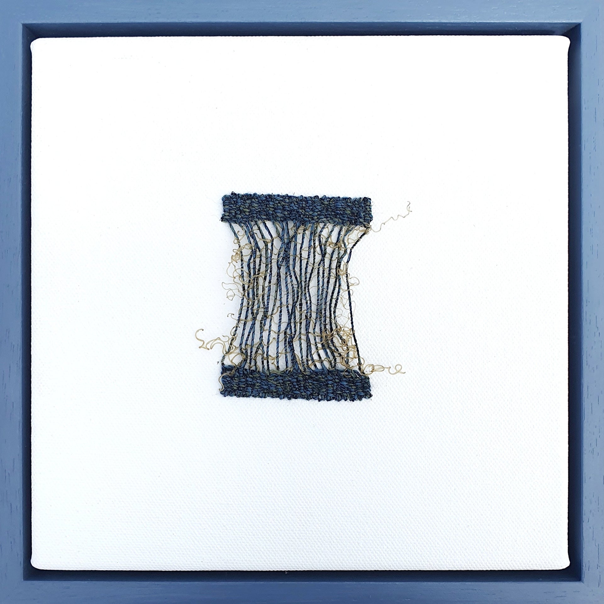 Delicate textile woven square piece in tones of blue and ochre by artist Jess Rippengale