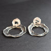 Silver flat circular stud earrings by Cornish artist Claire Stockings Baker