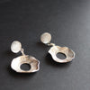Silver stud earrings with circular detailed drop by Cornish artist Claire Stockings Baker